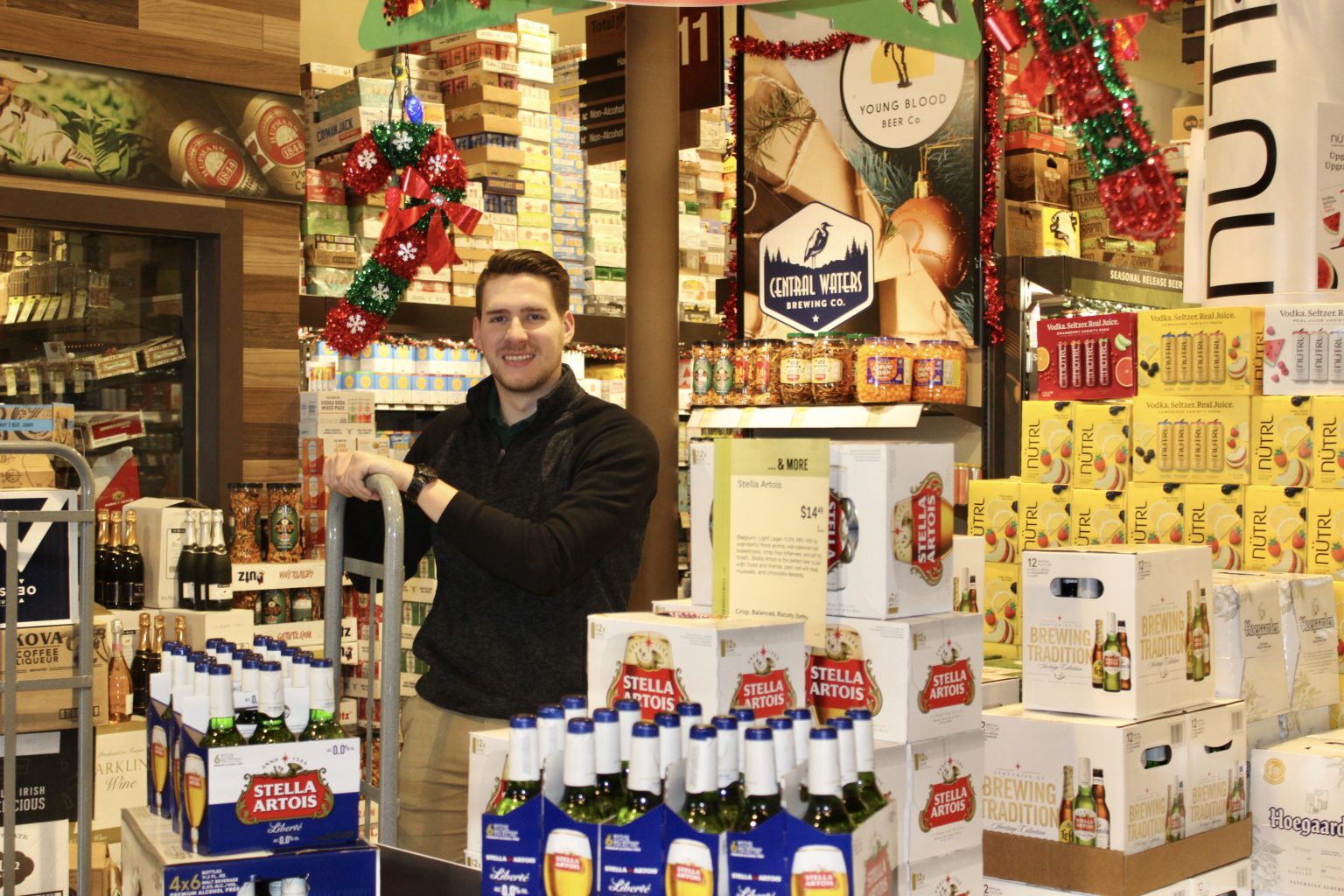 Merchandiser in front of Stella Display